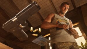 Jason in a Leonida vest loads a gun, a large pistol and cartridges in the foreground. Image: Rockstar Games.