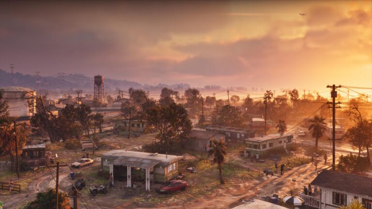 Port Gellhorn at sunset, a derelict strip mall and petrol station under a water tower. Image: Rockstar Games.